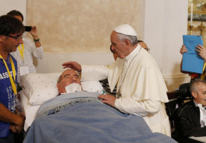 Pope Francis blesses a sick man inside the Basilica of Our Lady of Bonaria in Cagliari, Sardinia, Sept. 22. (CNS photo/Paul Haring) (Sept. 23, 2013) See POPE-SARDINIA Sept. 23, 2013.